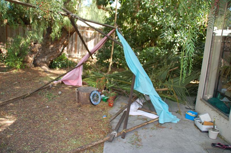 DSC_4223 - 2009-10-04 at 13-15-11.jpg - When the wind gust hit and knocked the sukkah over, one of the four roof beams broke.